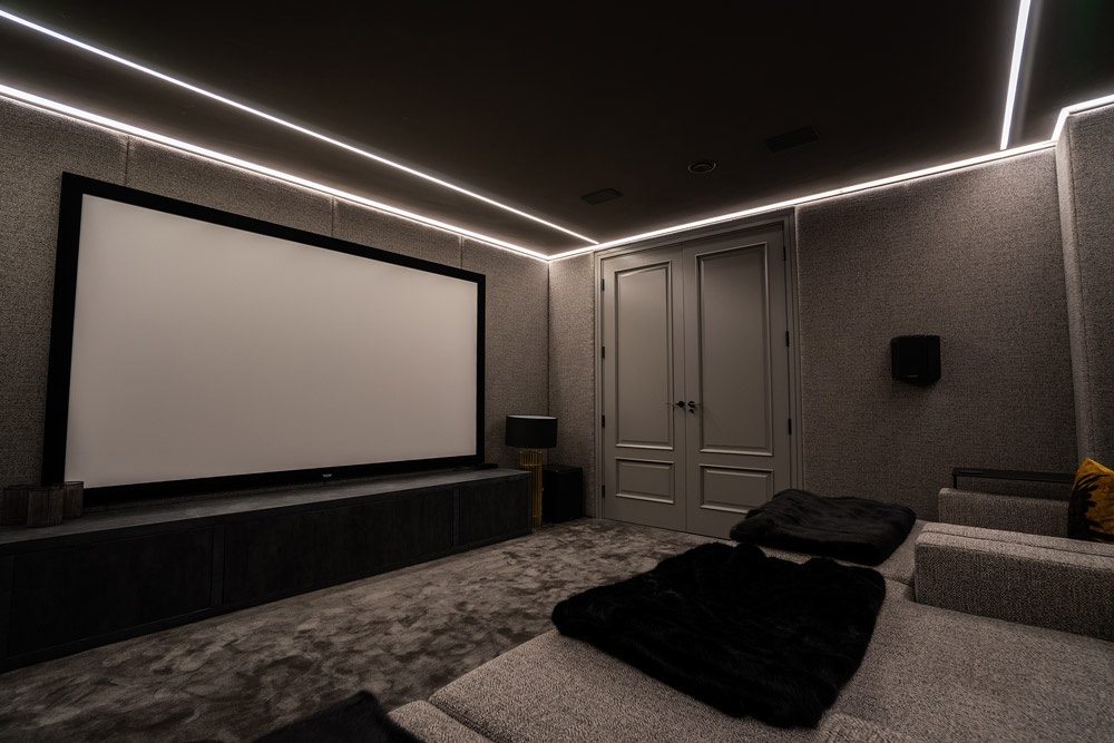 A home cinema outlined with LED strip in the ceiling