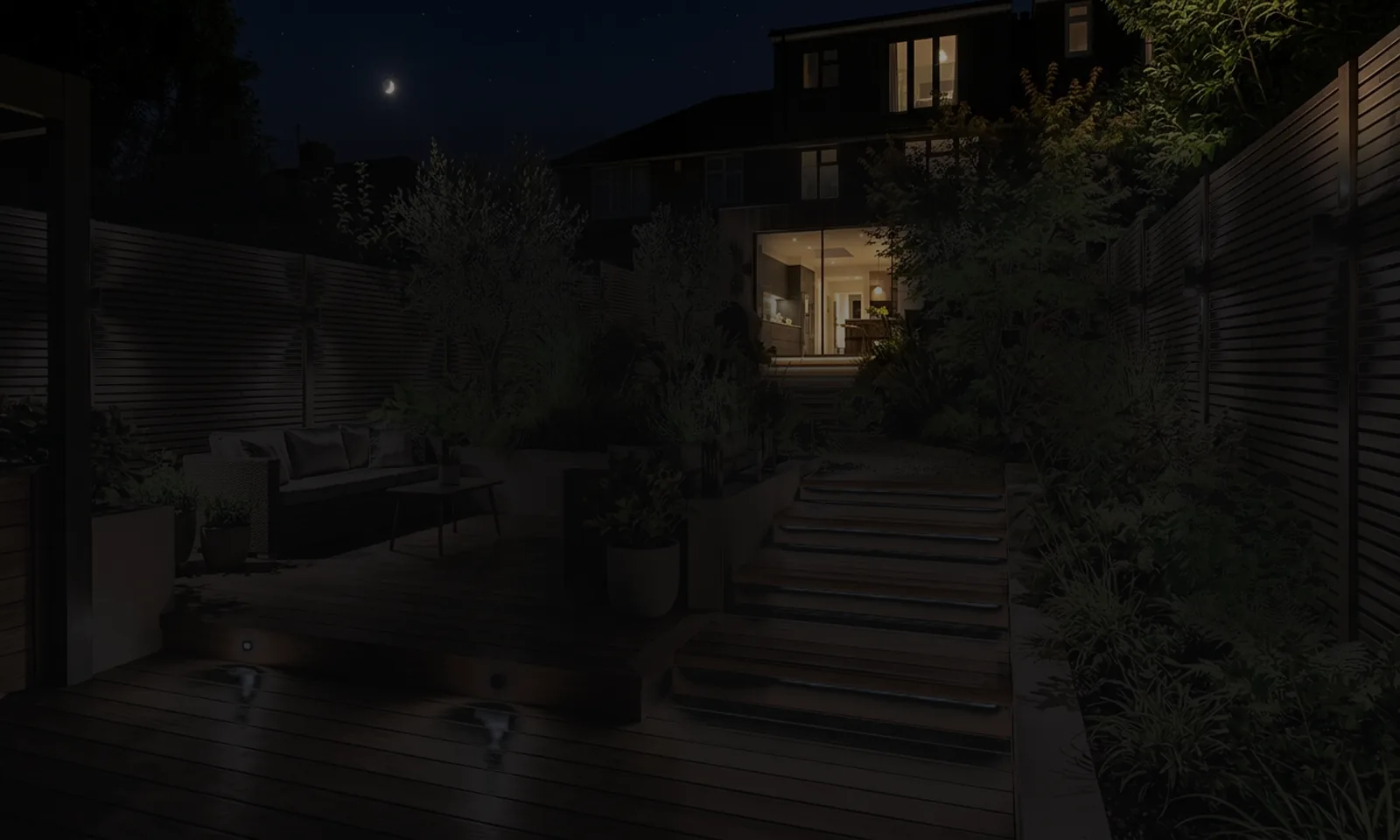 A contemporary garden at night with the lighting off