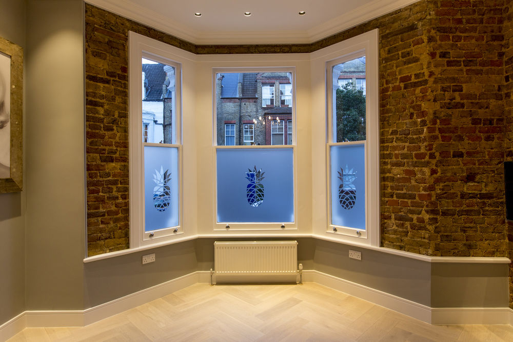 plaster-in trimless downlights in window