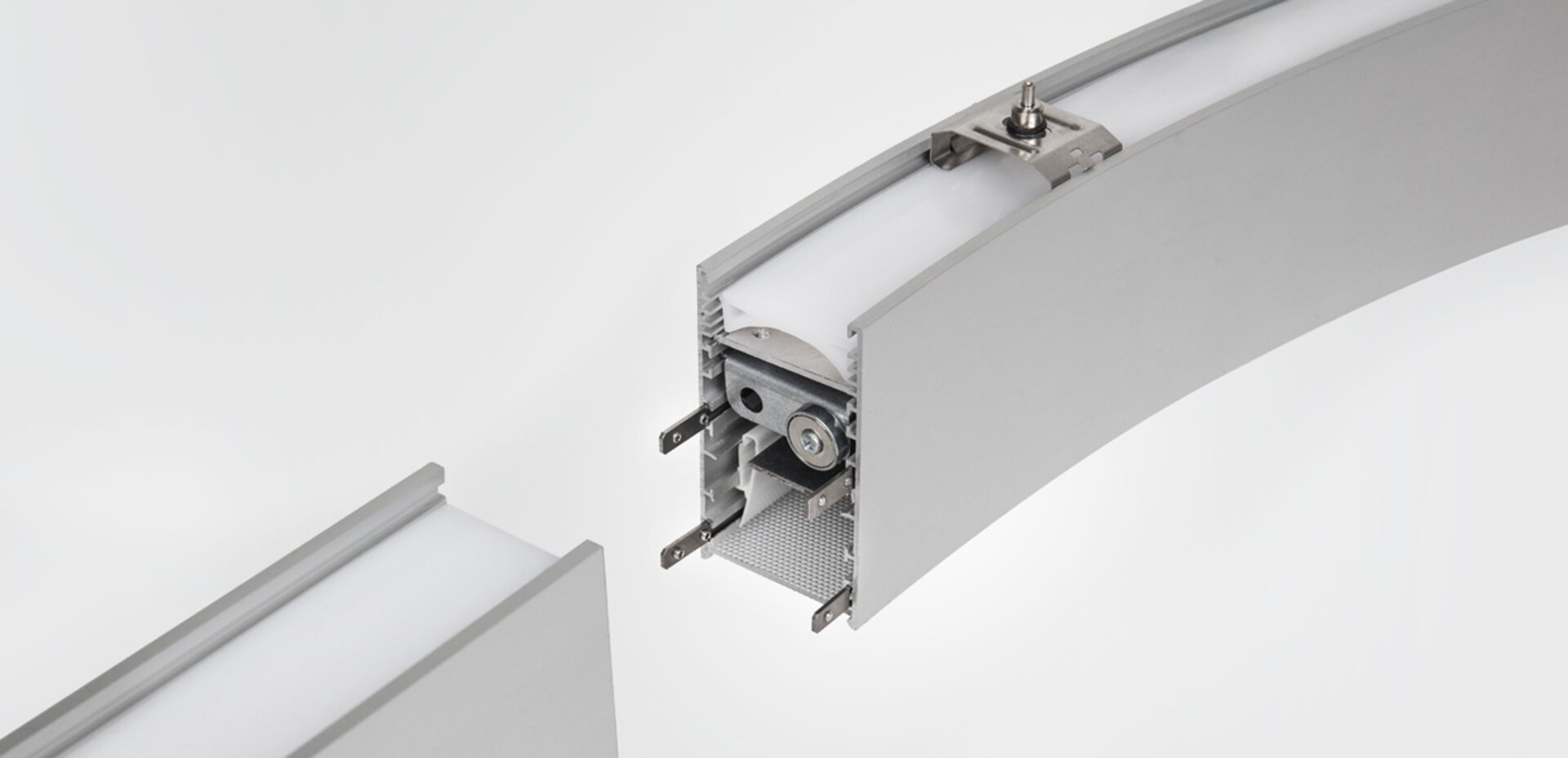 Close-up of the Serpent Plus magnetic joint: the magnet and electrical contacts inside the profile, with a straight and a curved module about to meet